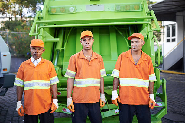 Garbage collection- the men who make it happen Cropped portrait of a garbage collection team street sweeper stock pictures, royalty-free photos & images