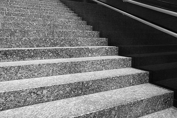 istock Granite stairs and a concrete wall in modern building 484189627