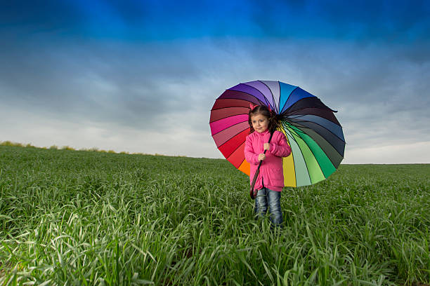 Little girl on tender wheat