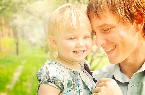 istock Father and baby daughter in sunny day 484190351