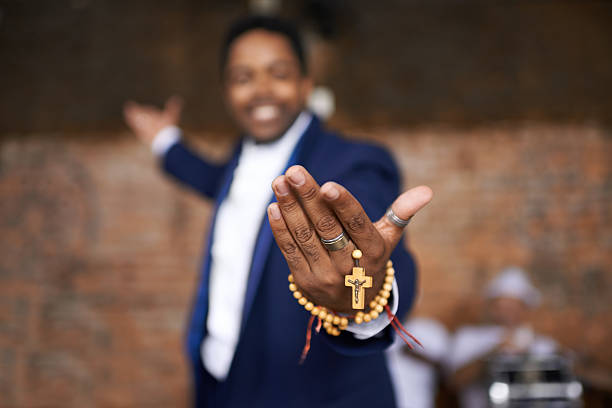 Portrait of an ethnic man standinf on a stage and holding his rosary beadshttp://195.154.178.81/DATA/i_collage/pi/shoots/783271.jpg