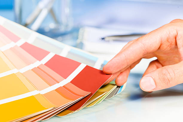 istock Artist hand browsing color samples in palette 484194492