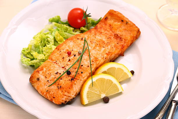 istock Grilled salmon filet and vegetables, close up 484194863