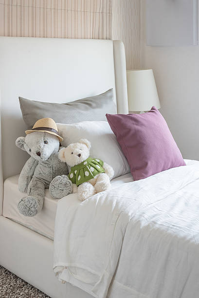istock kid's bedroom with dolls and pillow on bed 484198686