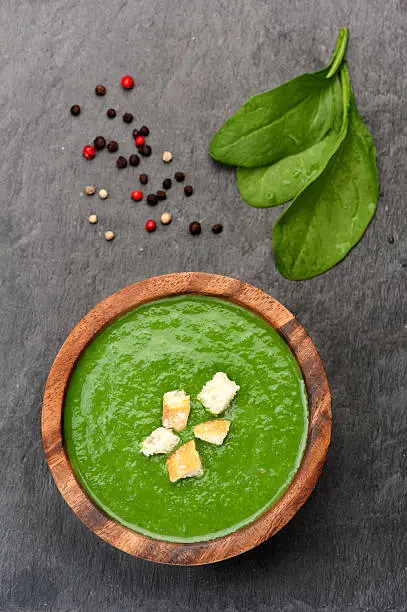 Traditional spinach cream soup with croutons