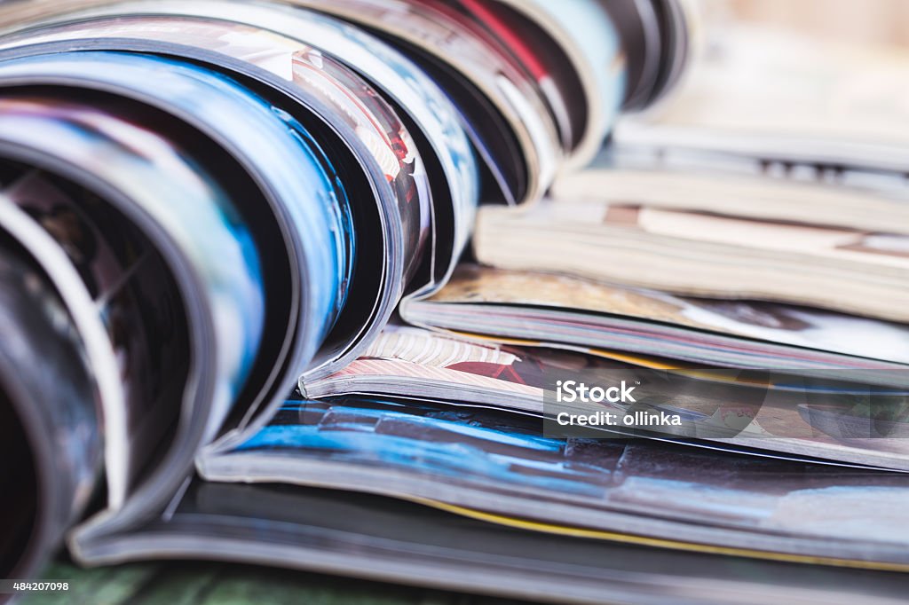 stack of open colorful magazines. information Printmaking Technique Stock Photo