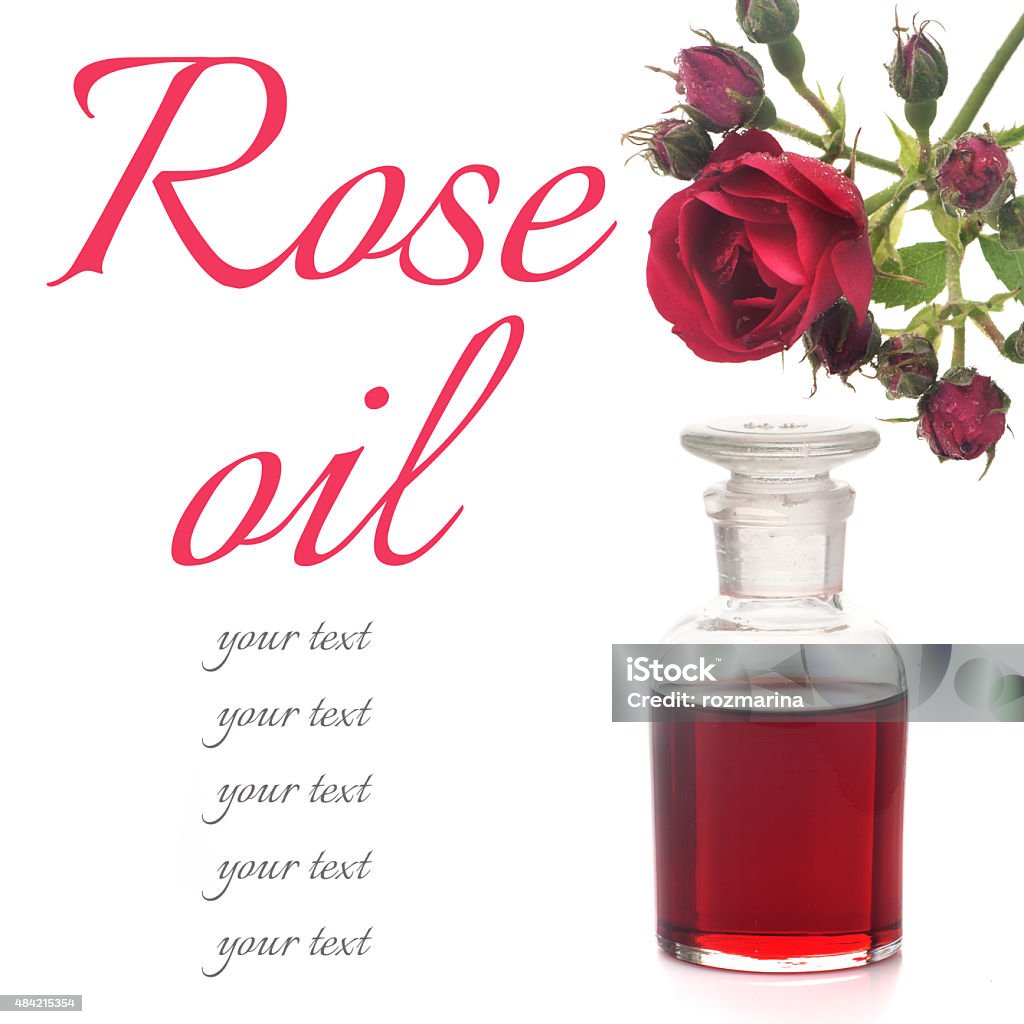 Rose essential oil and rose flowers Rose essential oil and rose flowers on a white background 2015 Stock Photo