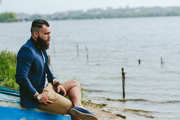 istock American Bearded Man looks on the river bank 484215626