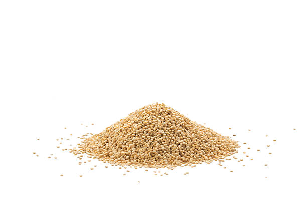 Pile of quinoa seeds isolated on a white background