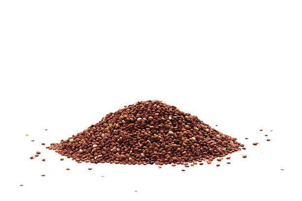 Pile of quinoa seeds isolated on a white background stock photo