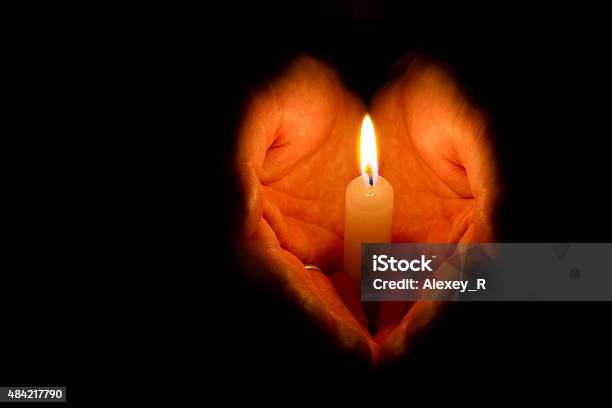 Man Hands Holding A Burning Candle Stock Photo - Download Image Now - Candle, Memorial Vigil, Christmas