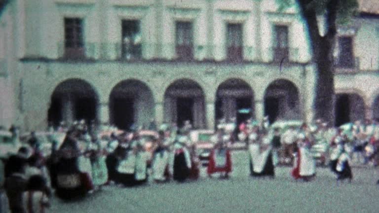 1974: Traditional native dancing on city square for holiday event.