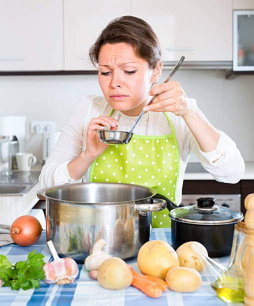 istock Woman smelling something bad in kitchen 484218762