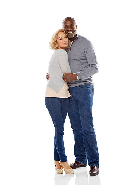 istock Loving mature couple standing together on white 484221793