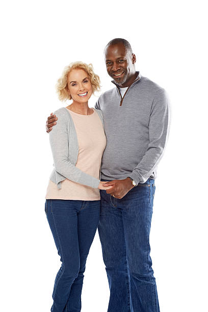 istock Happy mature couple standing together on white 484221801