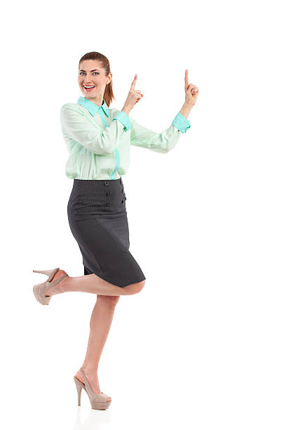 istock Smiling woman pointing up. 484221851