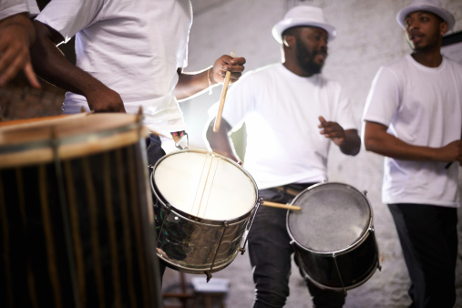 Shot of a band playing their percussion instruments in a Brazilian setting