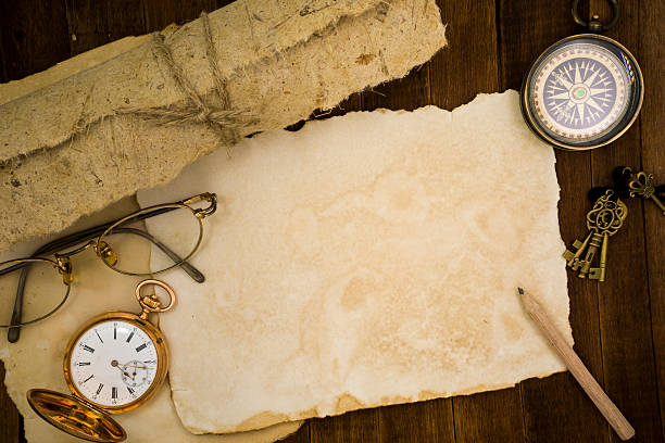 istock Old paper, compass, pocket watch on wooden background 484222376