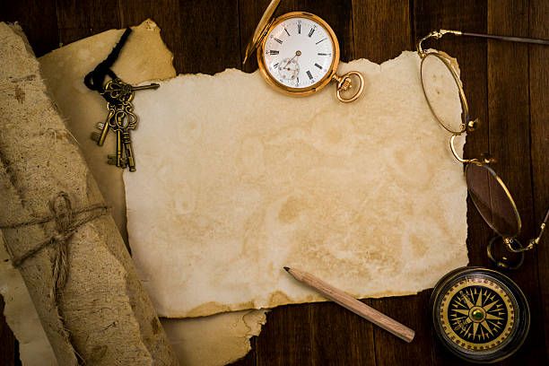 istock Old paper, compass, pocket watch on wooden background 484222380