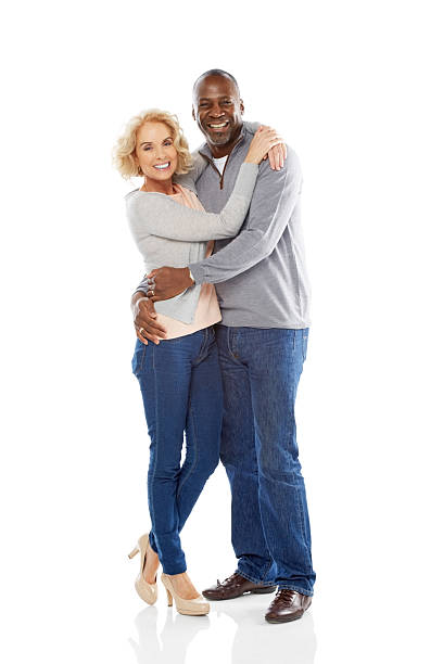 istock Loving mature couple embracing over white background 484223069