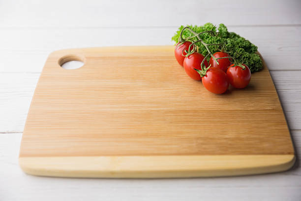istock Chopping board tomatoes and parsley 484226040