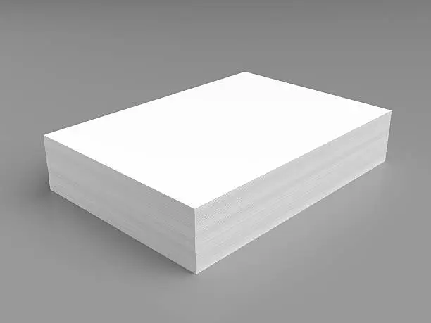 Stack of white paper on grey background