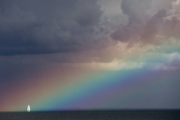 segelschiff der von regenbogen - solitude remote sailboat horizontal stock-fotos und bilder