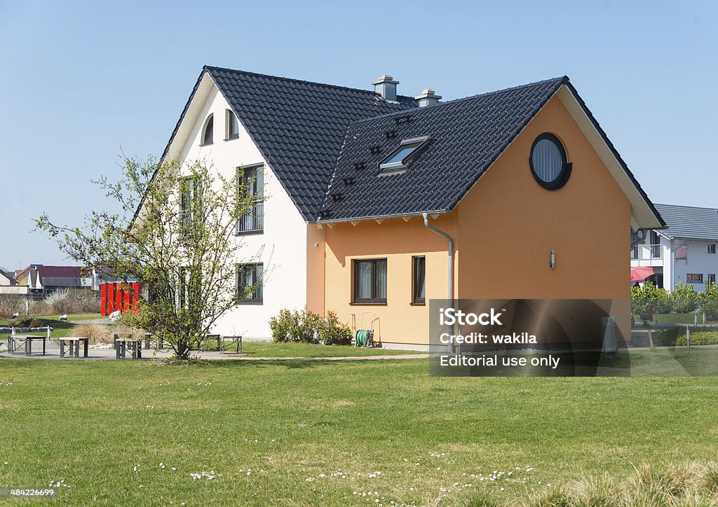 house real estate home with garden meadow - Einfamilienhaus Nuremberg, Germany - March 29, 2014: house real estate home with garden meadow - Einfamilienhaus. Picture taken in "Fertighauspark" near Nuremberg/Erlangen in Germany. It's a demohouse with no real people live in there. Blue Stock Photo