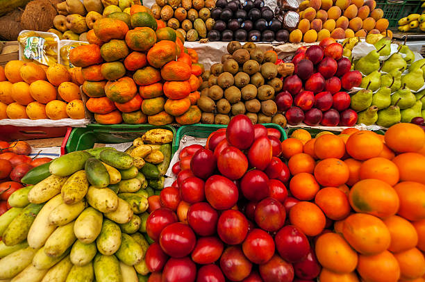 Healthy food. Mauritius. Local market. Fresh fruit and pineapple packaged at the daily bazaar market.