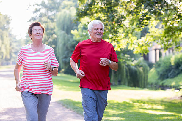 istock Senior couple - jogging in the park 484227050