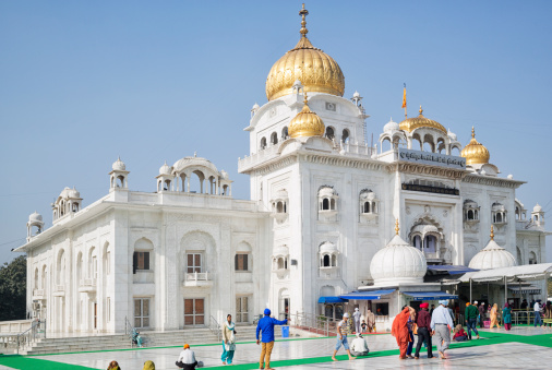 Delhi, India - March 16, 2014: Gurudwara Bangla Sahib is the most prominent Sikh Temple, or Sikh house of worship in Delhi. People in the image are local indian sikhs and/or tourists.