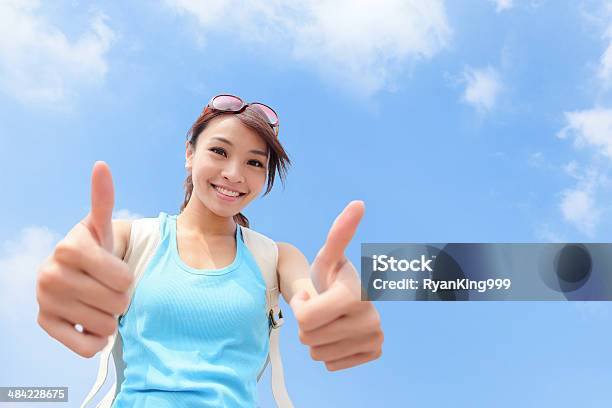 Smiling Woman Tourist Showing Thumbs Up Stock Photo - Download Image Now - OK Sign, Thumbs Up, Tourism