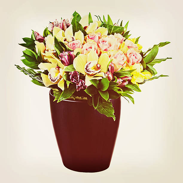istock Bouquet of roses and orchids with retro filter effect. 484228777