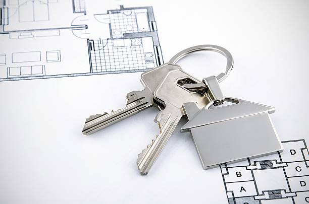 istock Keys and house chrome pendant with home shape 484230344