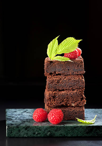 istock Chocolate cake brownies with raspberries 484231138