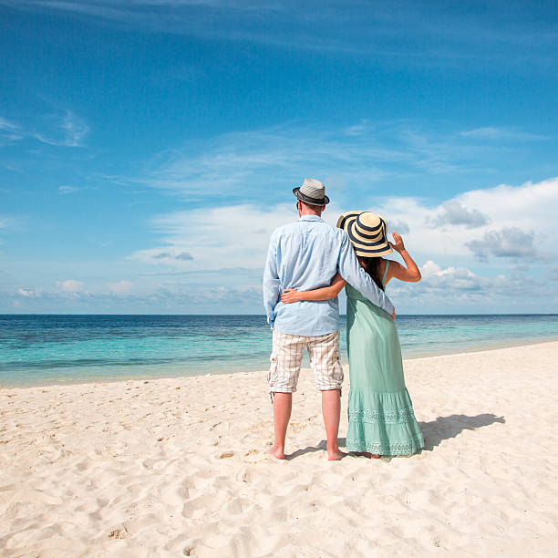 istock Vacation Couple walking on tropical beach Maldives. 484231922