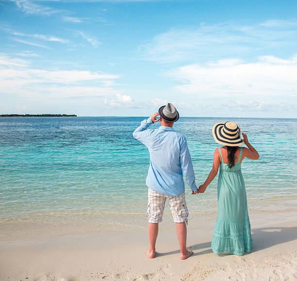 istock Vacation Couple walking on tropical beach Maldives. 484231924