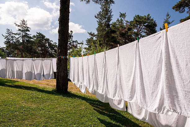istock fresh clean white towels drying on washing line in outdoor 484234530