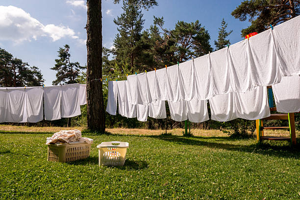 istock fresh clean white towels drying on washing line in outdoor 484237454