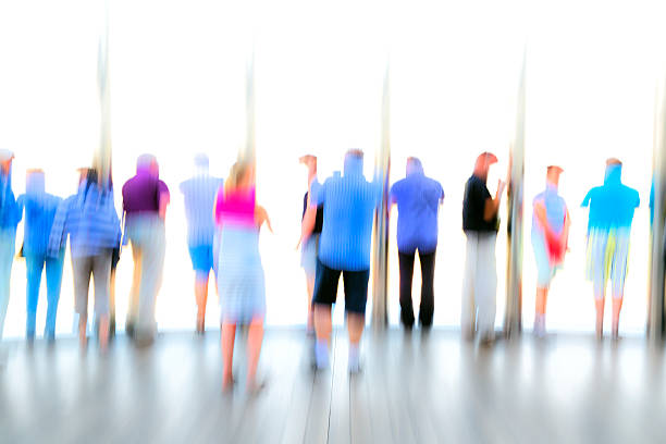 istock Large Group of Blurred, Unrecognizable People 484244112