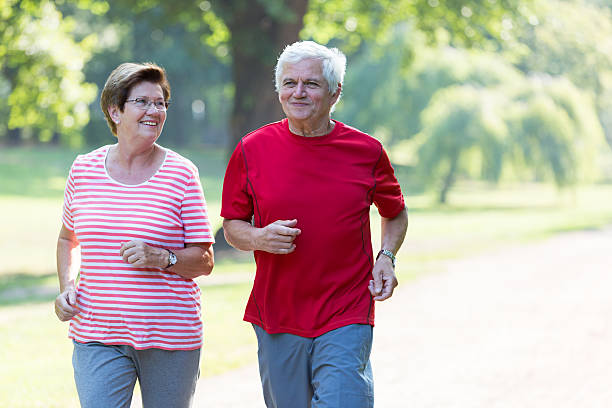 istock Senior couple - jogging in the park 484244536