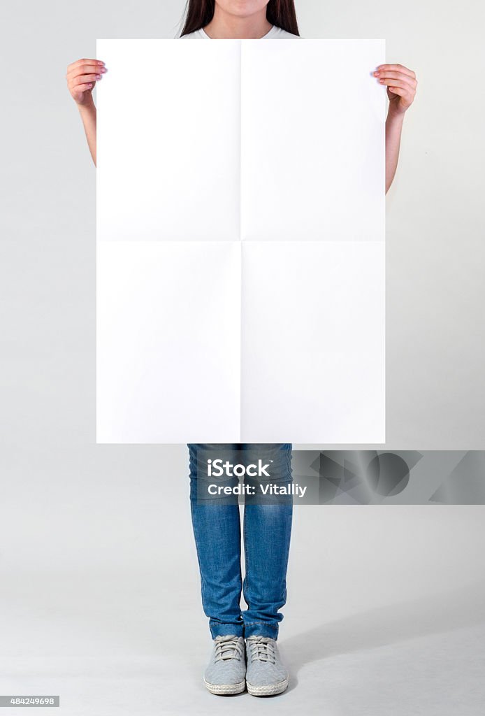 Blank poster Woman holding a blank poster Poster Stock Photo