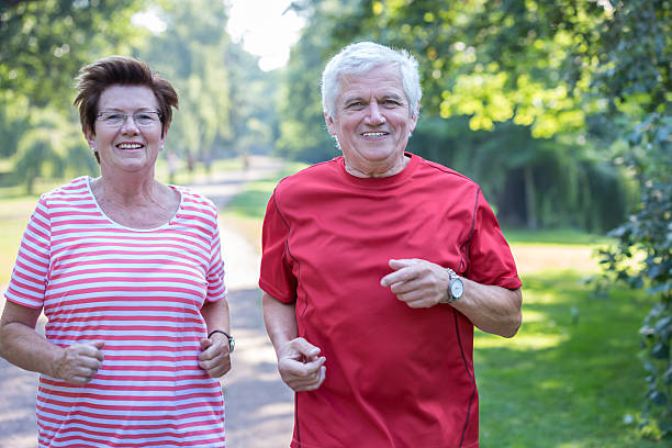 istock Senior couple - jogging in the park 484252128