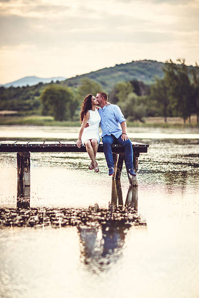Couple sitting on jetty