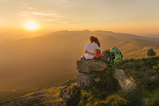istock Happy couple enjoy beautiful view in the mountains 484256414