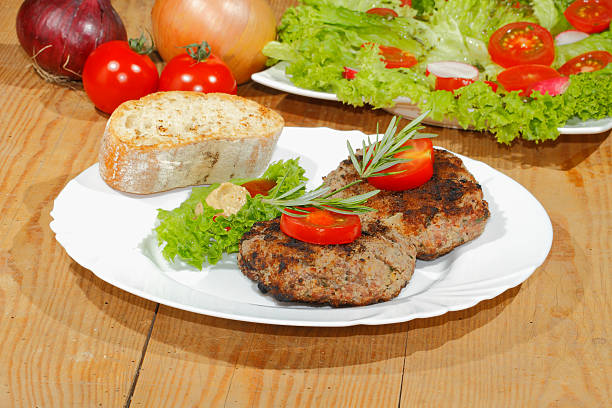 istock Grilled beef patties, spicy sauces, plates 484258602