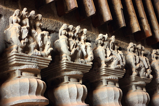 Ancient sculptures in Buddhist Karla caves in Maharashtra, India.