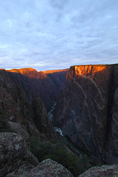 istock Golden sun hitting cliff walls 484259684