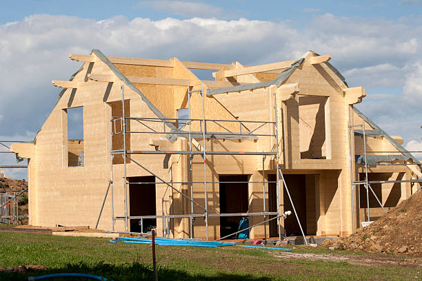 Wooden house under construction stock photo