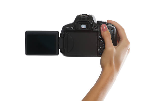 istock Female hand with digital camera isolated on white 484261624